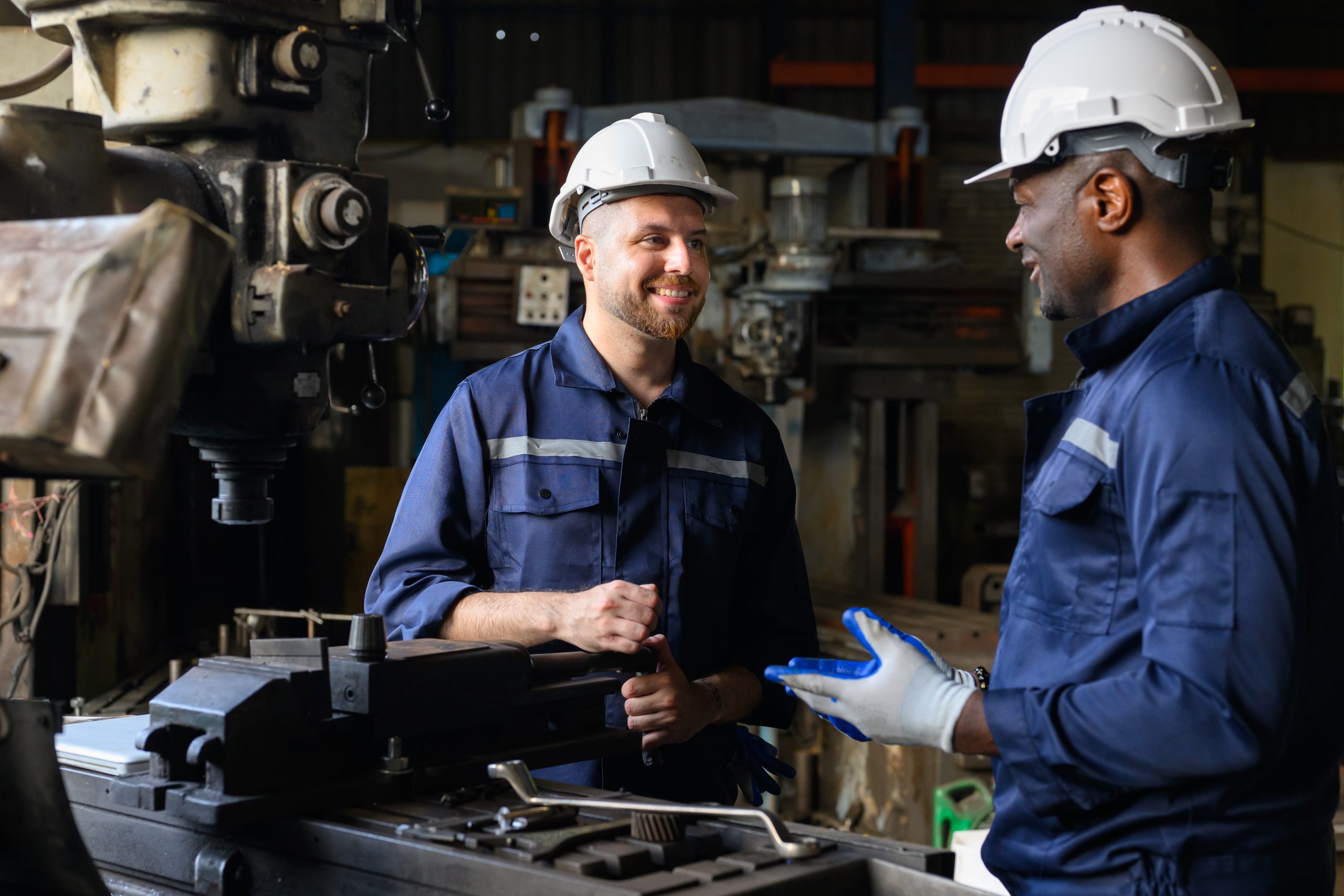 Two industrial engineers team with safety uniform